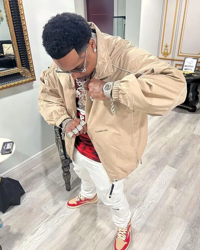 Finesse2tymes outfit in Bape, Amiri, and Reves Paris, 2023