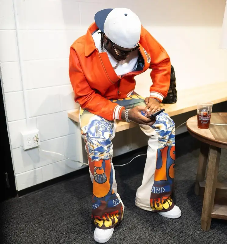 Fivio Foreign outfit in Avirex, Cout De La Liberte, and Nike, 2023