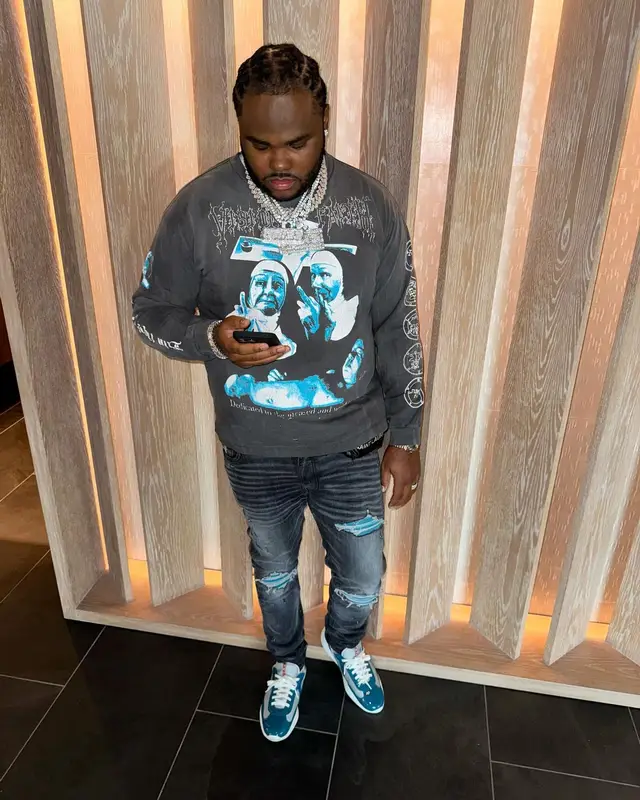 Tee Grizzley outfit in Saint Michael, Amiri, and Prada, 2023