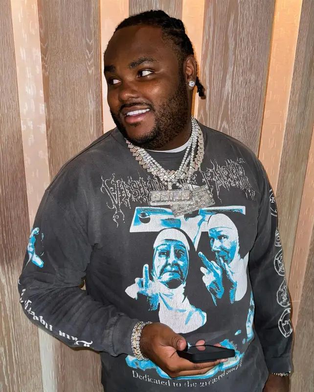Tee Grizzley outfit in Saint Michael, Amiri, and Prada, 2023