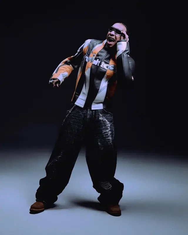 Tyga outfit in Louis Vuitton and Oscar and Frank, 2023