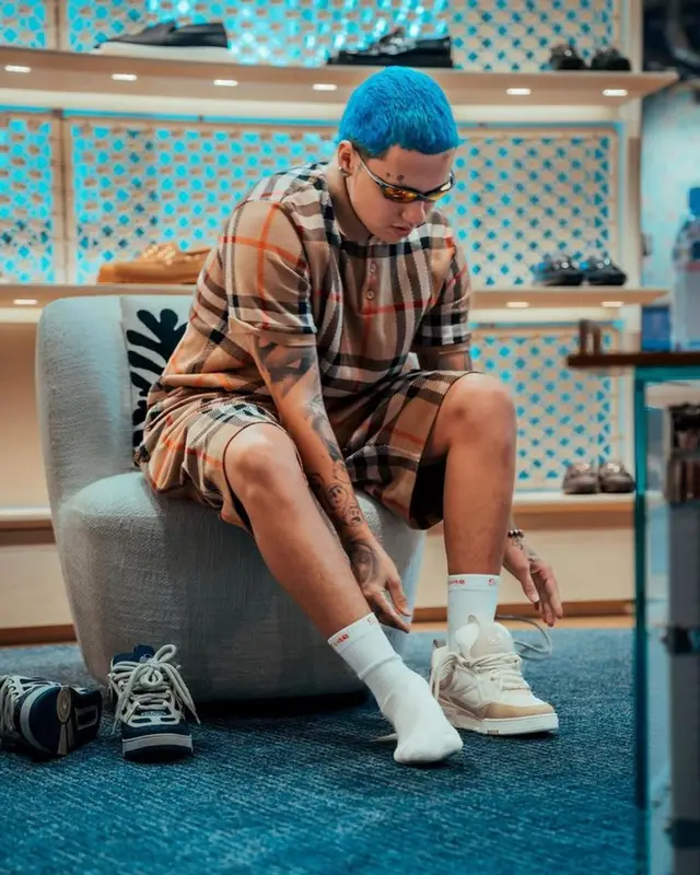 Blessd outfit in Burberry, Oakley, and Supreme, 2023