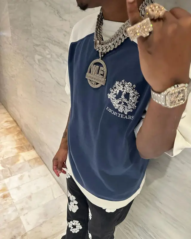 Kenny Muney outfit in Dior, Nike, and Denim Tears, 2023