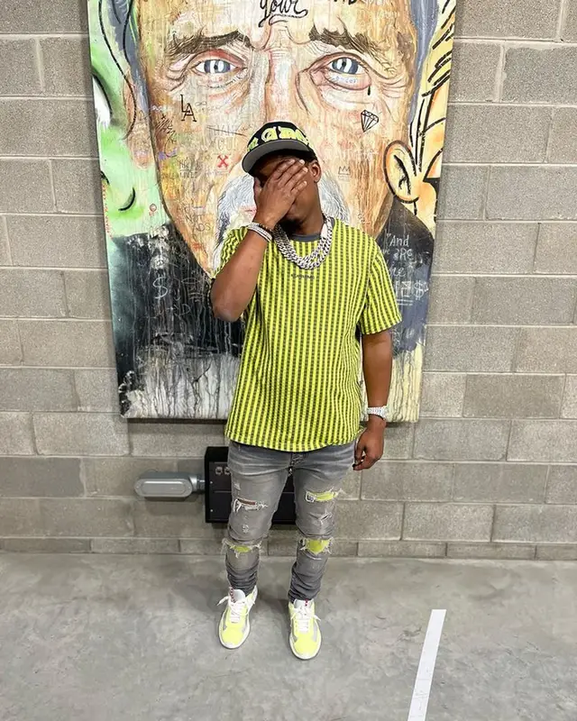 Baby Money outfit in Supreme, Amiri, and Prada, 2023