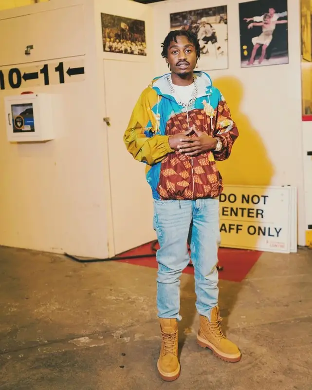 Lil Tjay outfit in Louis Vuitton and Amiri, 2023