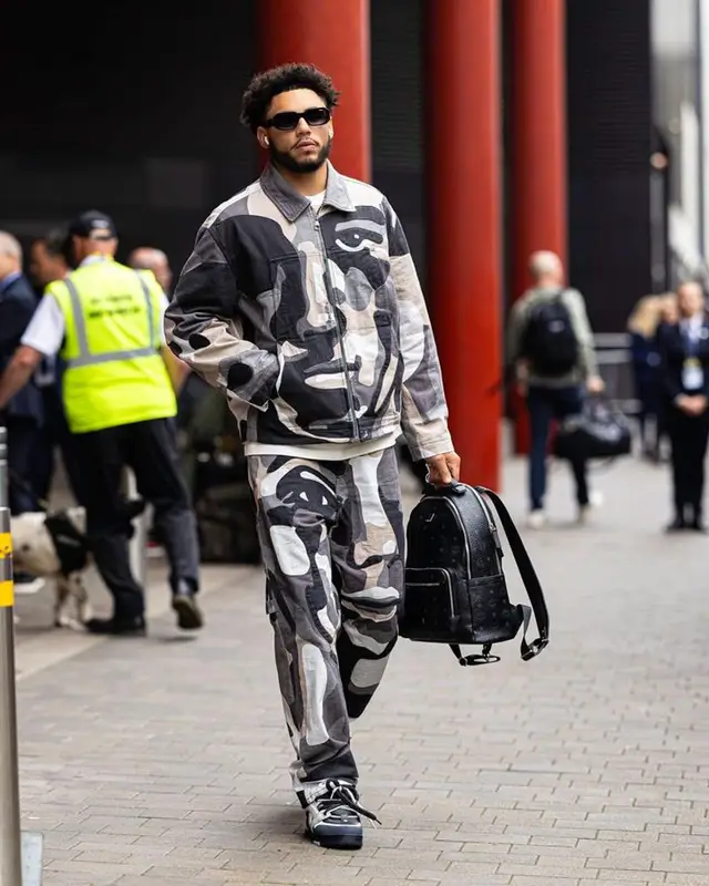 Drake London outfit in Louis Vuitton and MCM, 2023