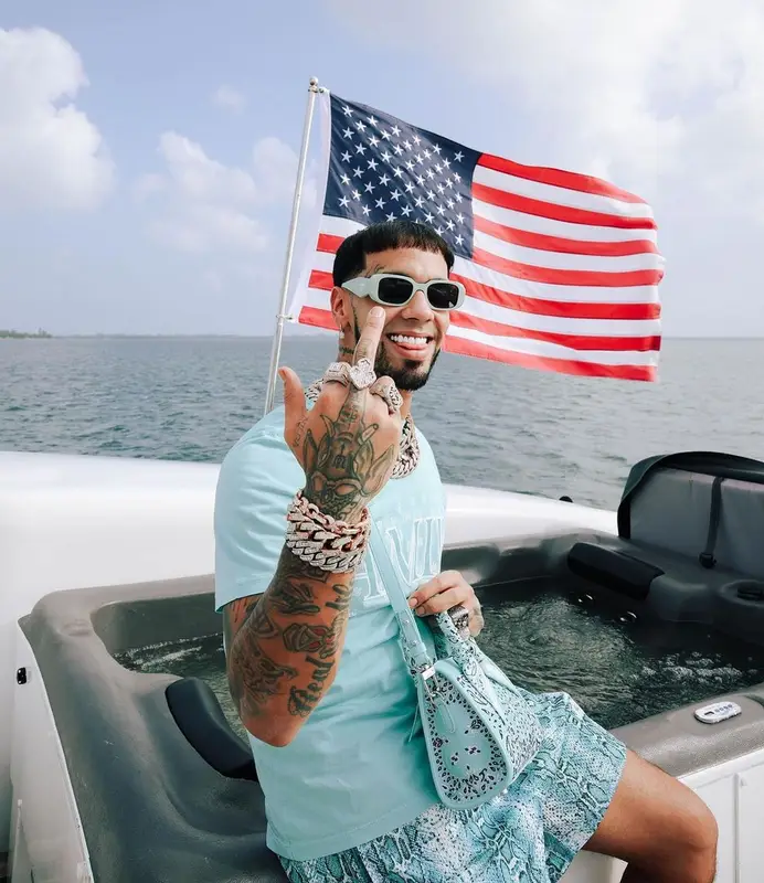 Anuel AA outfit in Amiri, Eric Emanuel, and Prada, 2023