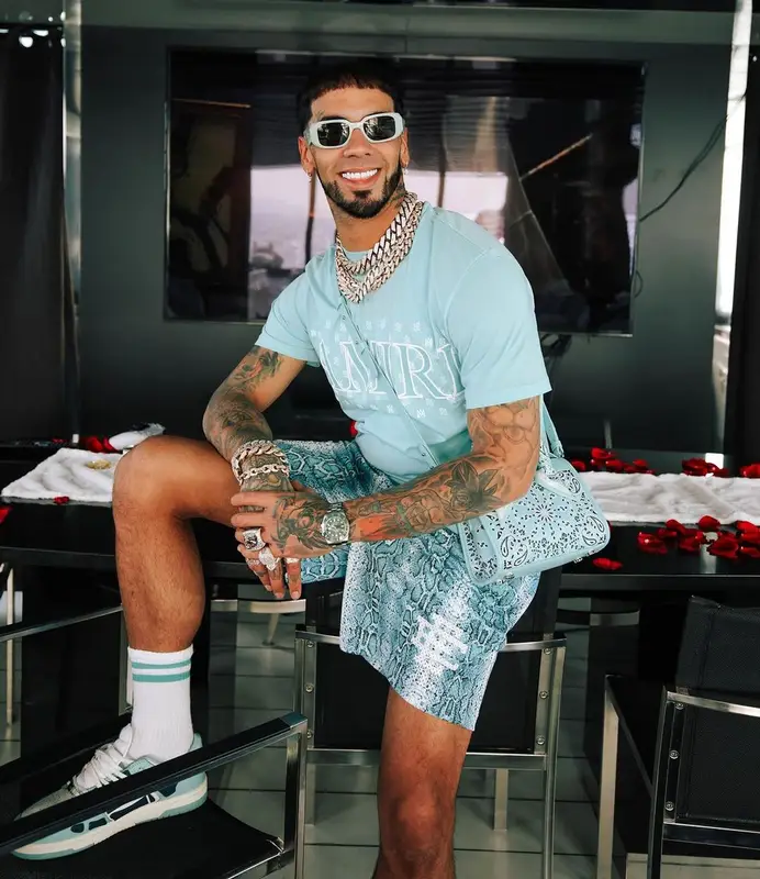 Anuel AA outfit in Amiri, Eric Emanuel, and Prada, 2023