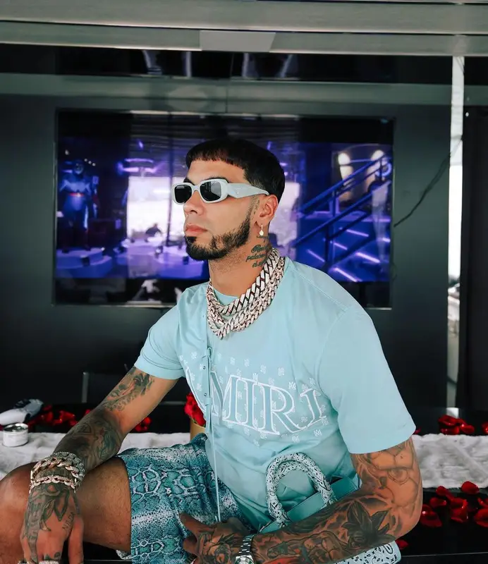 Anuel AA outfit in Amiri, Eric Emanuel, and Prada, 2023