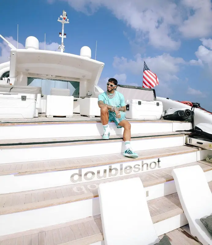 Anuel AA outfit in Amiri, Eric Emanuel, and Prada, 2023