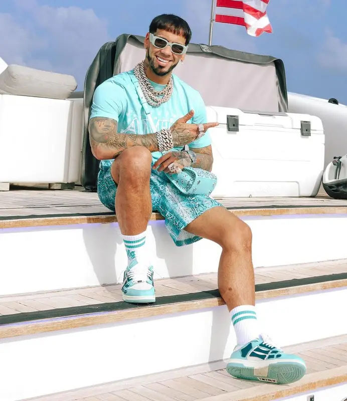 Anuel AA outfit in Amiri, Eric Emanuel, and Prada, 2023