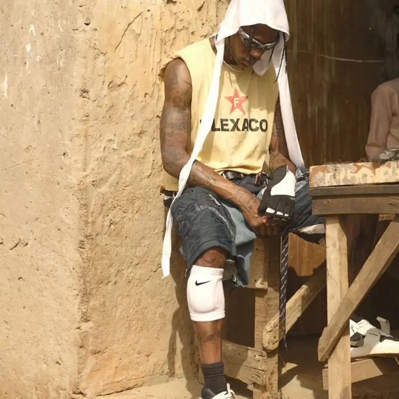 Travis Scott outfit in Nike, Oakley, and Jordan, 2023