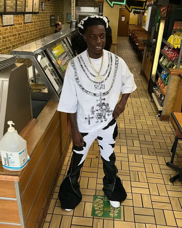 OMB Peezy outfit in Ricco Gioventu, Billionaire Studios, and Nike, 2023