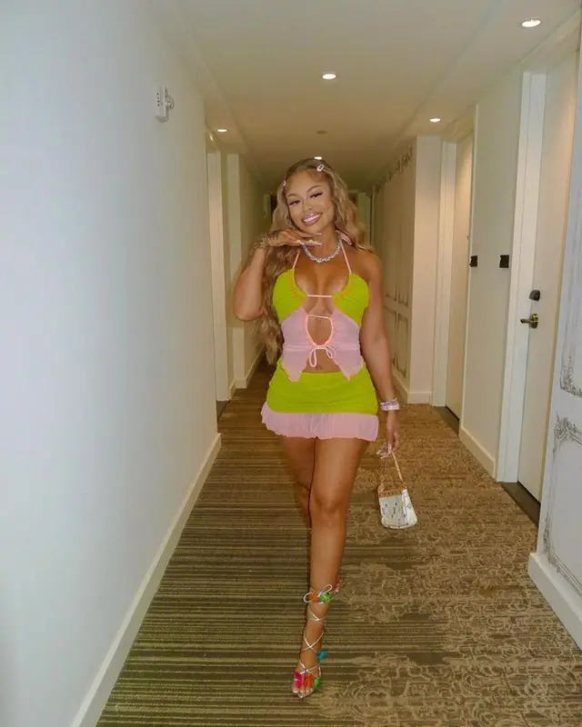 Latto outfit in Emrld, Louis Vuitton, and Sophia Webster, 2023