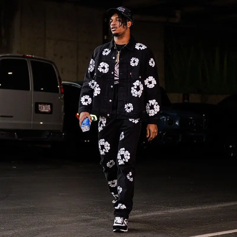 Ja'Marr Chase outfit in Levi’s, Chanel, and Denim Tears, 2023
