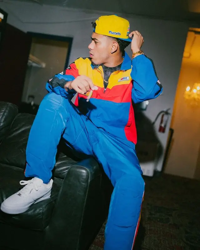Myke Towers outfit in Polo Ralph Lauren, Nike, and Mitchell & Ness, 2023