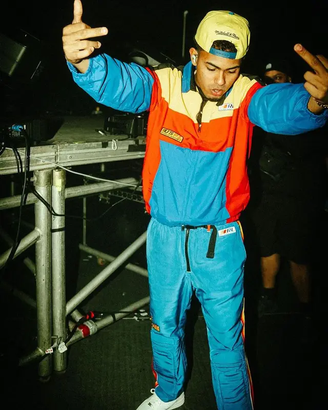 Myke Towers outfit in Polo Ralph Lauren, Nike, and Mitchell & Ness, 2023
