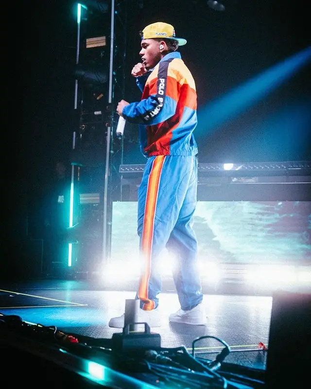 Myke Towers outfit in Polo Ralph Lauren, Nike, and Mitchell & Ness, 2023