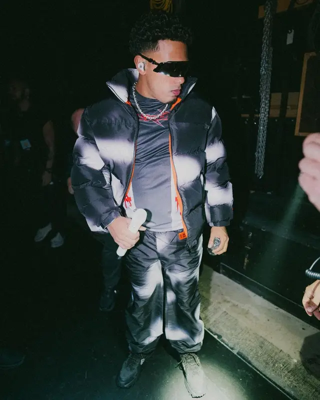 Myke Towers outfit in Heron Preston, 2023