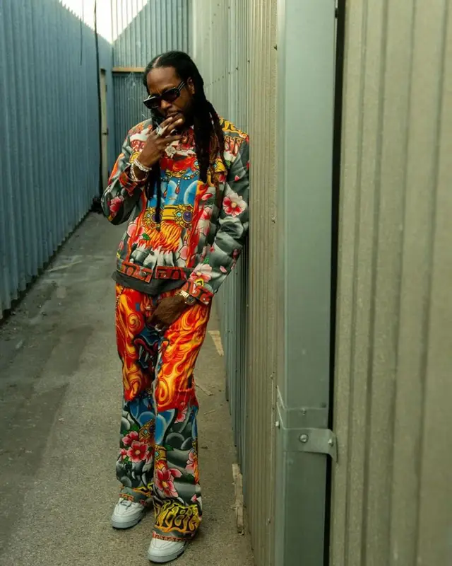 2 Chainz outfit in Cout De La Liberte, Louis Vuitton, and Valentino, 2023