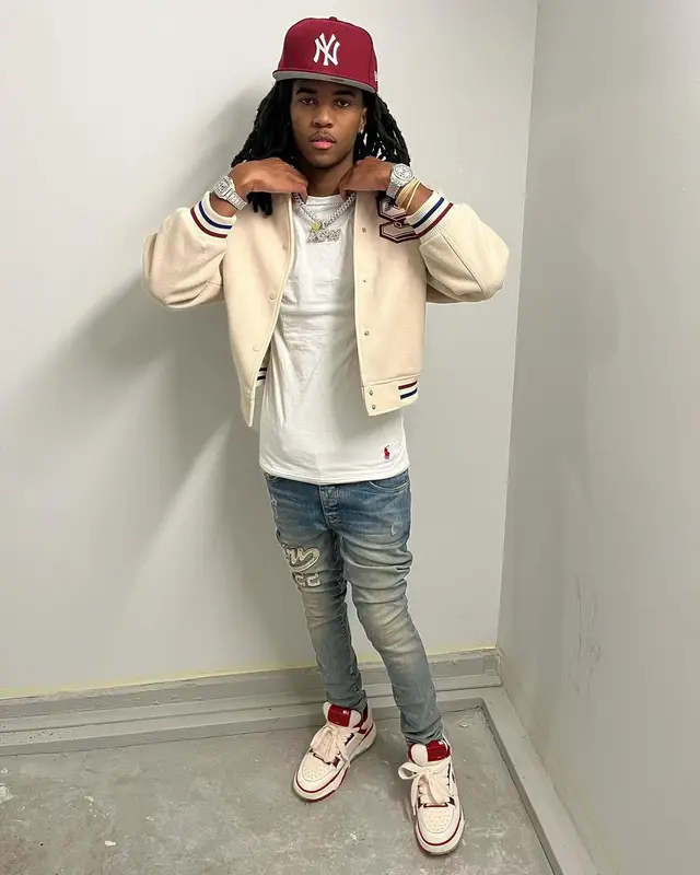 Lil Darius outfit in H&M, Polo Ralph Lauren, and New Era, 2023