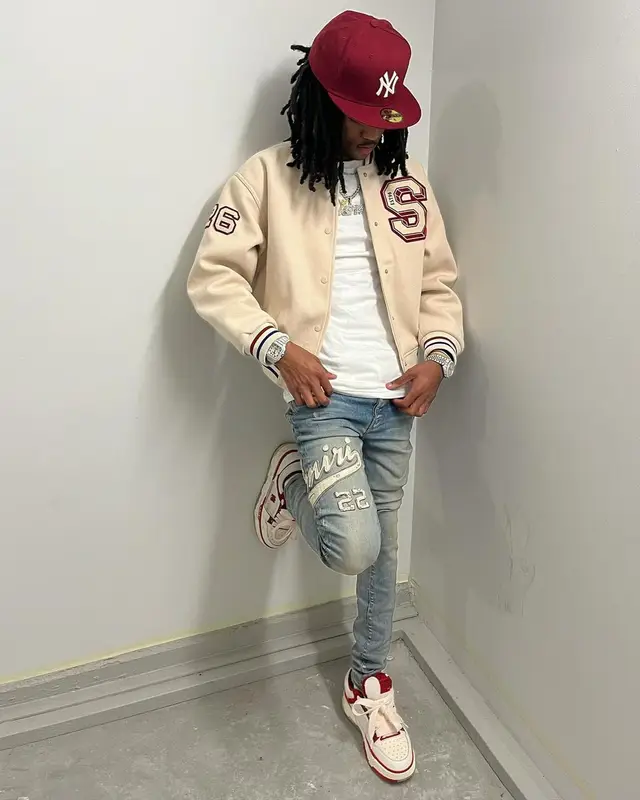 Lil Darius outfit in H&M, Polo Ralph Lauren, and New Era, 2023