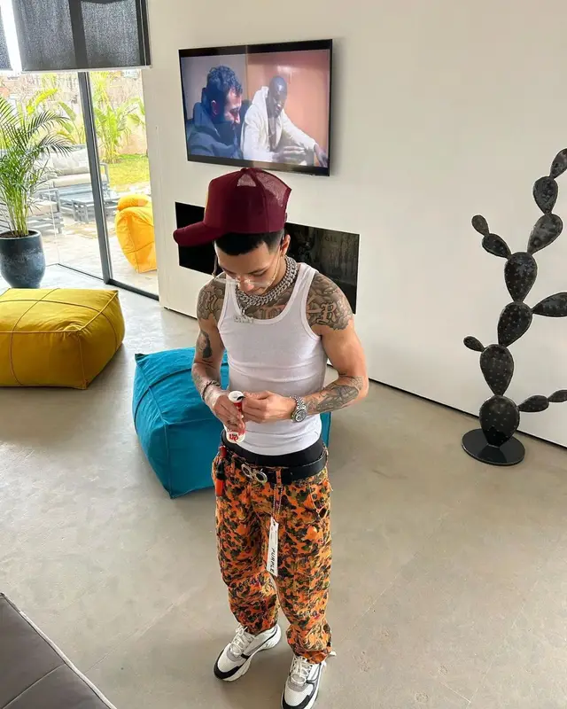 Larry outfit in Hanes, Purple Brand, and Ferragamo, 2023