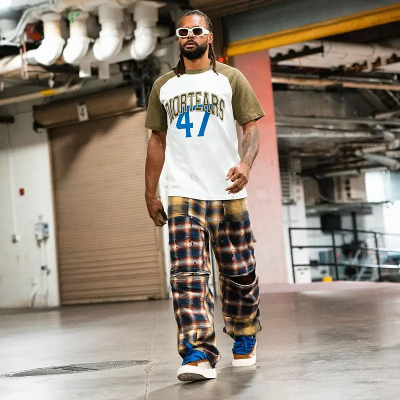 Patty Mills outfit in Dior, Givenchy, and Denim Tears, 2023