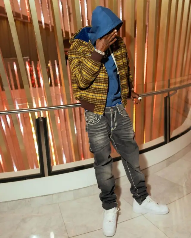 Lil Tjay outfit in Supreme, True Religion, and Nike, 2023