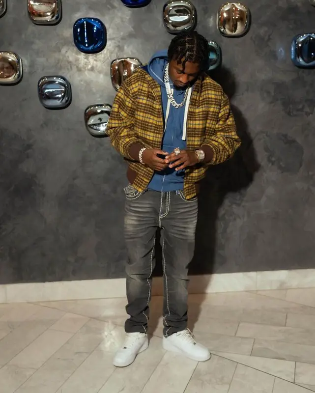 Lil Tjay outfit in Supreme, True Religion, and Nike, 2023