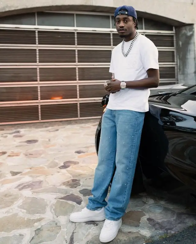 Lil Tjay outfit in Valentino, Loewe, and Nike, 2023