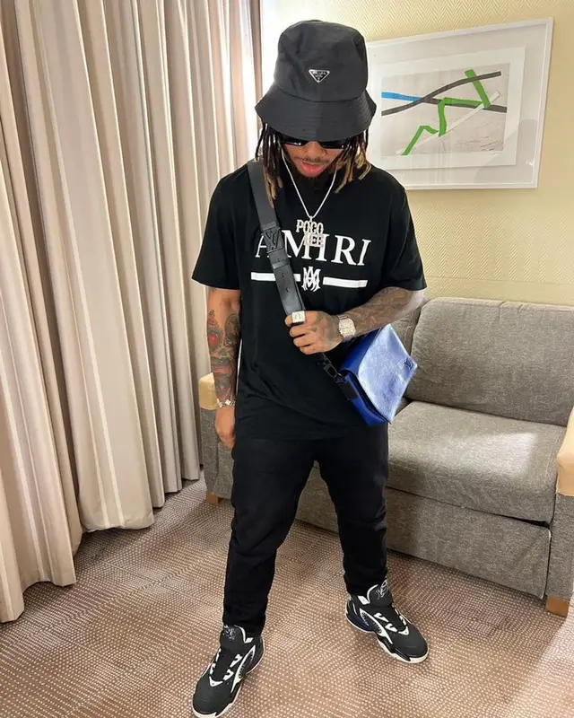 Poco Lee outfit in Amiri, Louis Vuitton, and Prada, 2023