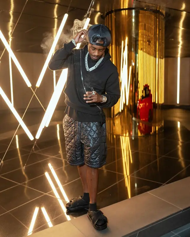Lil Tjay outfit in Junya Watanabe, Maison Margiela, and Bottega Veneta, 2023