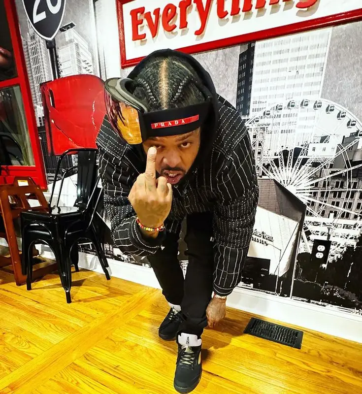Westside Gunn outfit in Denim Tears, Prada, and Oakley, 2023