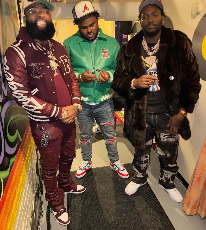 Tee Grizzley outfit in Avirex, Louis Vuitton, and New Era, 2023