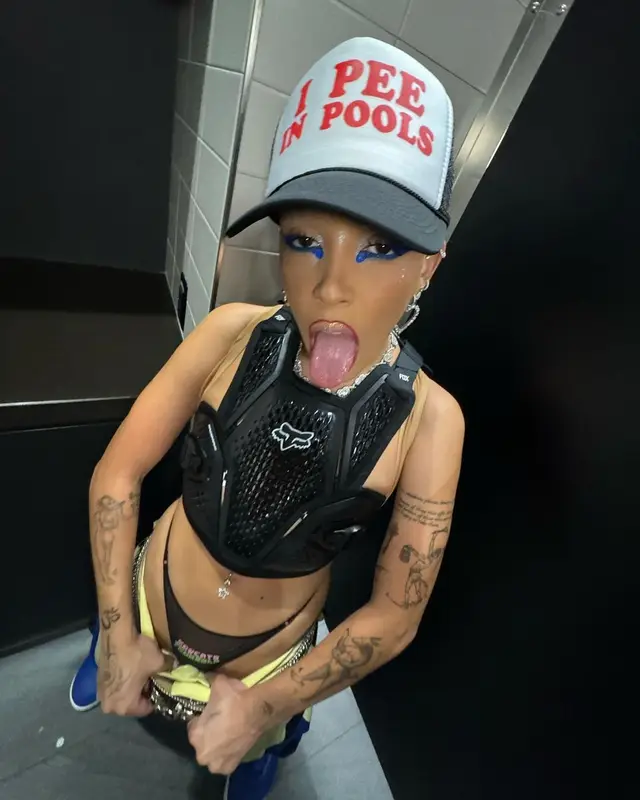 Doja Cat outfit in Kusikohc, B.B. Simon, and Fox Racing, 2023