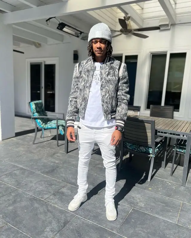 Skilla Baby outfit in Amiri, Givenchy, and Chanel, 2023
