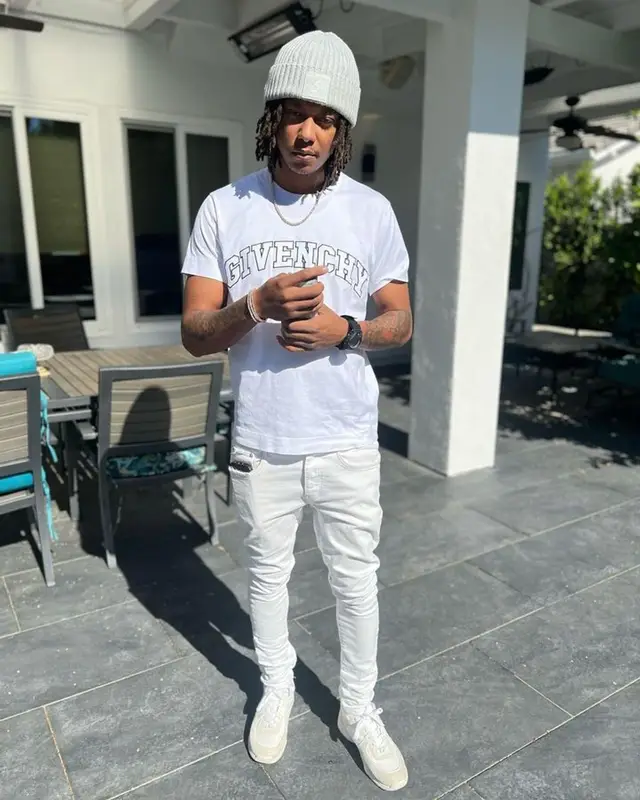 Skilla Baby outfit in Amiri, Givenchy, and Chanel, 2023