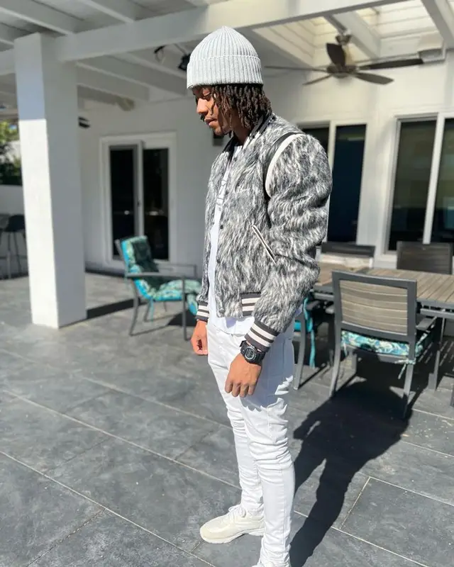Skilla Baby outfit in Amiri, Givenchy, and Chanel, 2023