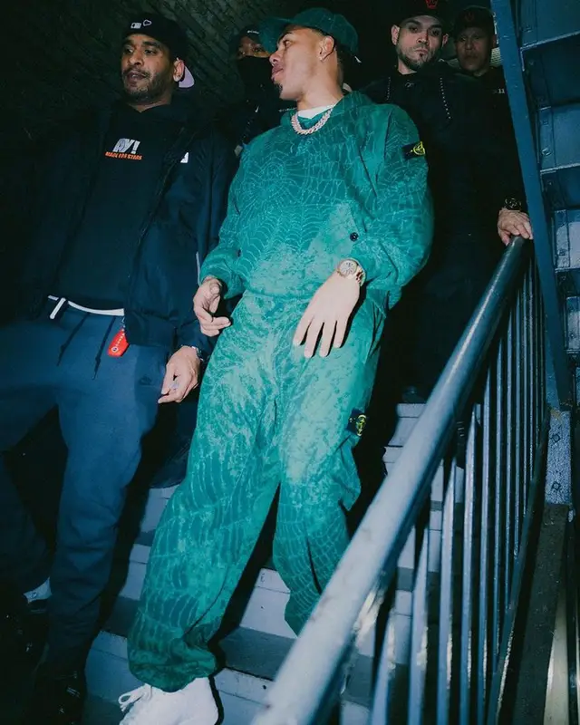 Myke Towers outfit in Oakley, Supreme, and Stone Island, 2023