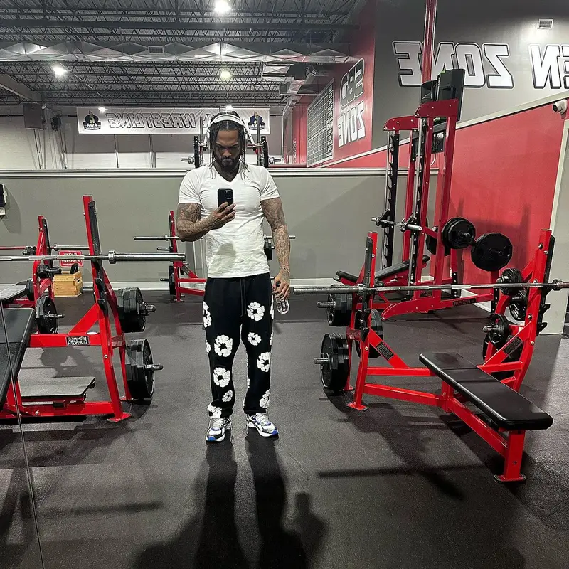 Dave East outfit in Hanes, Readymade, and Denim Tears, 2023