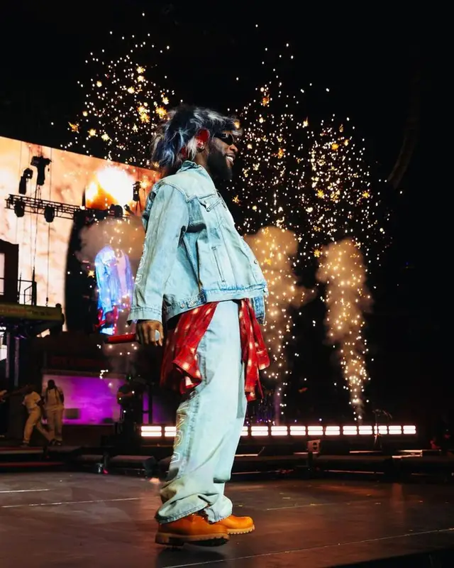 Burna Boy outfit in Balenciaga, Timberland, and Chrome Hearts, 2023