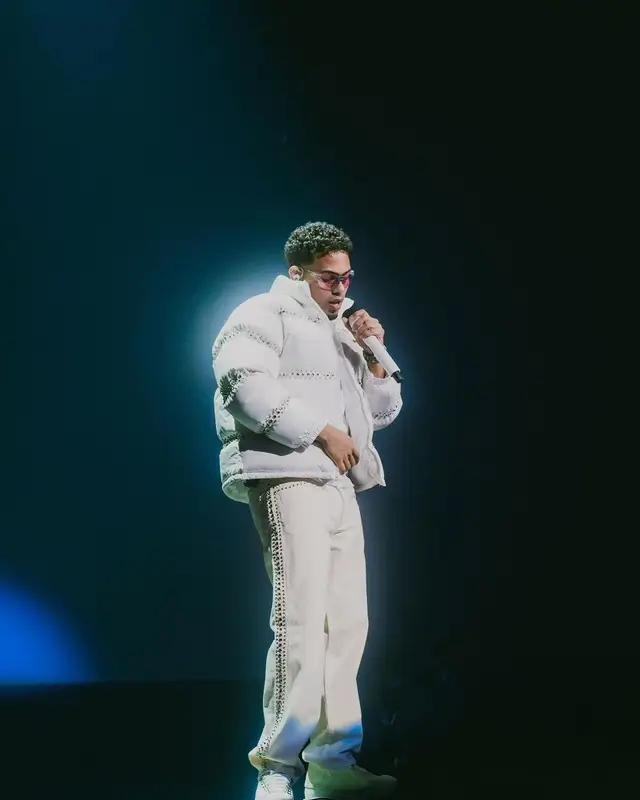 Myke Towers outfit in Supreme, Oakley, and B.B. Simon, 2023