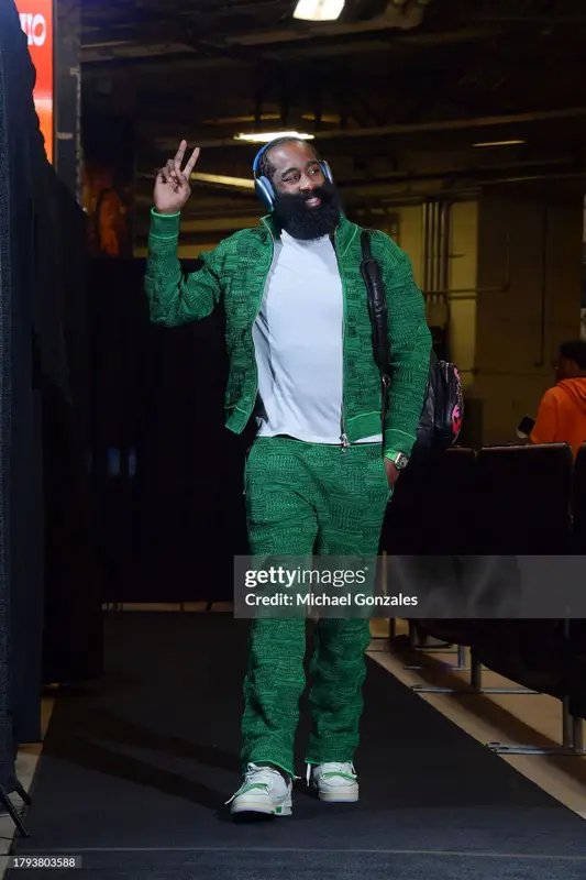 J. Cole outfit in Bottega Veneta, Louis Vuitton, and Apple, 2023