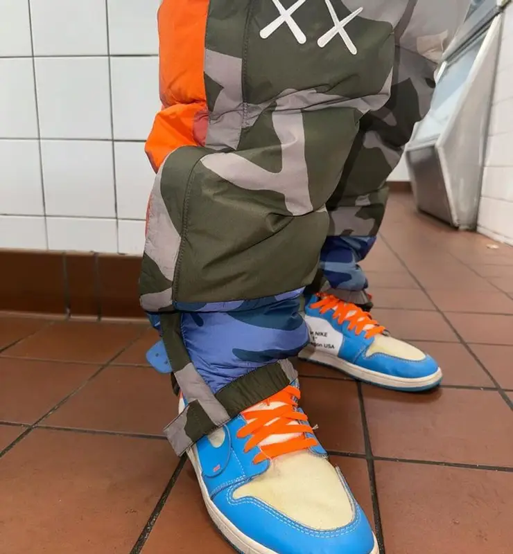 Maxo Kream outfit in Supreme, The North Face, and   Kaws, 2023