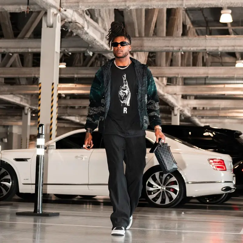 Davante Adams outfit in Dior, Raf Simons, and Prada, 2023