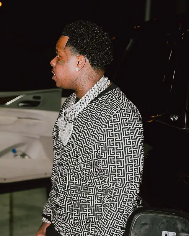 Finesse2tymes outfit in Balmain and Amiri, 2023