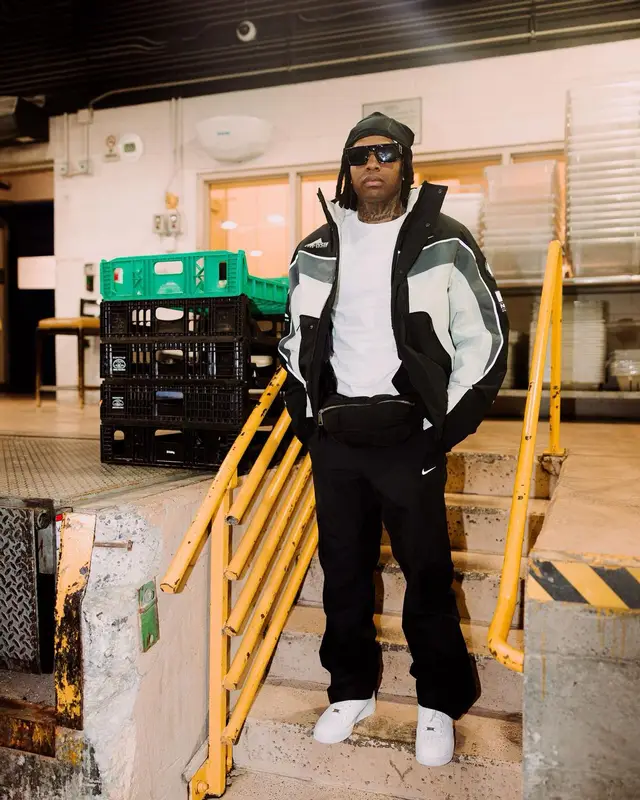 Lil Durk outfit in Nike, Louis Vuitton, and Nocta, 2023