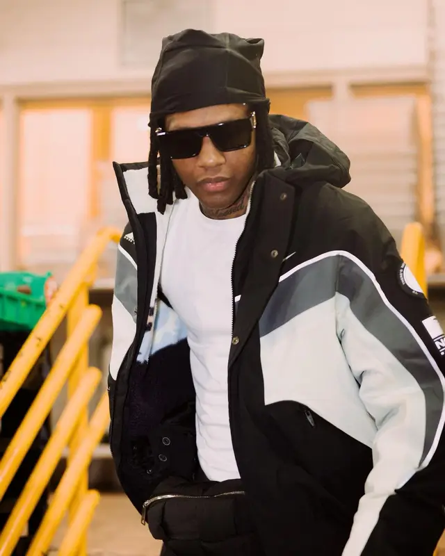 Lil Durk outfit in Nike, Louis Vuitton, and Nocta, 2023