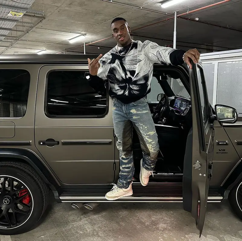 Bugzy Malone outfit in Alexander McQueen, Givenchy, and Louis Vuitton, 2023